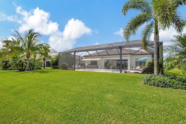 view of yard featuring a patio and a lanai