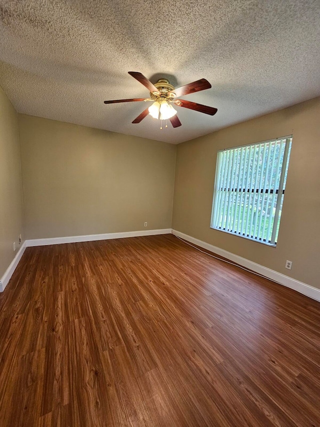 unfurnished room with a textured ceiling, hardwood / wood-style flooring, and ceiling fan