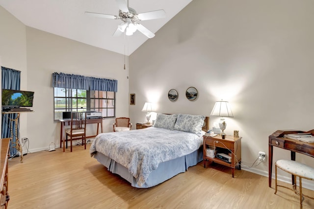 bedroom featuring ceiling fan, high vaulted ceiling, and hardwood / wood-style floors