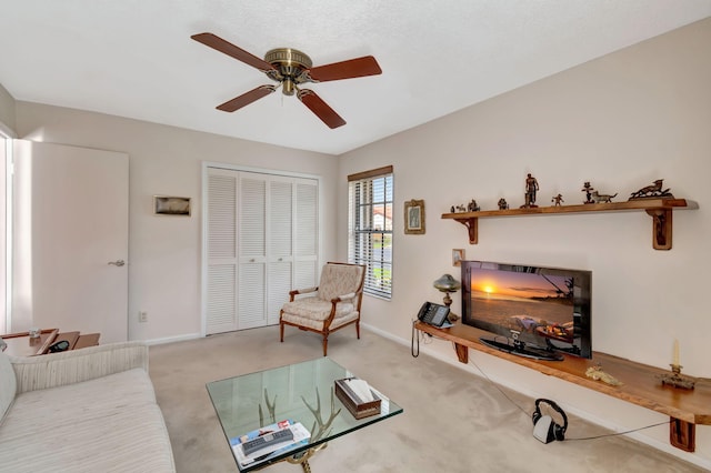 living room featuring light carpet and ceiling fan