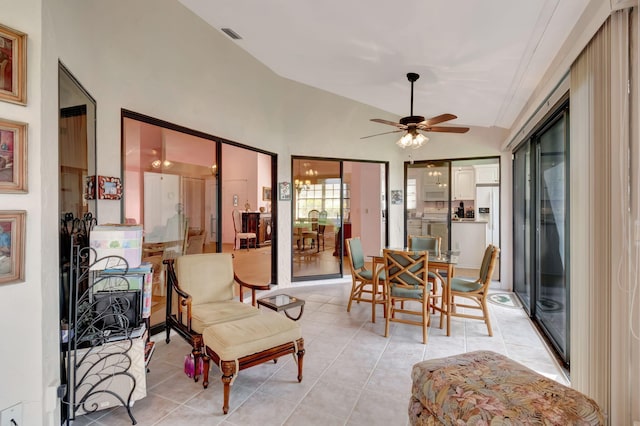 sunroom / solarium featuring ceiling fan and vaulted ceiling