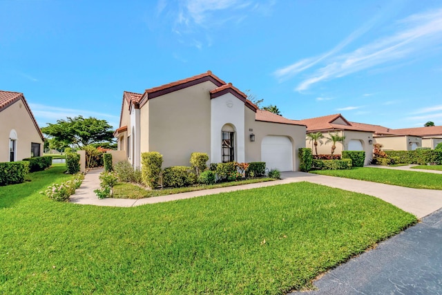 8282 Mooring Cir, Boynton Beach, FL 33472 - mediterranean / spanish home featuring an attached garage, stucco siding, a front yard, and driveway