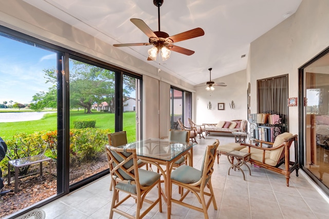 sunroom featuring vaulted ceiling and ceiling fan