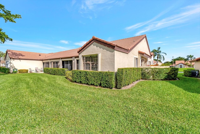 rear view of house with a lawn