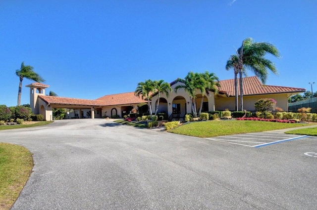 8282 Mooring Cir, Boynton Beach, FL 33472 - mediterranean / spanish-style house with uncovered parking, stucco siding, and a tile roof