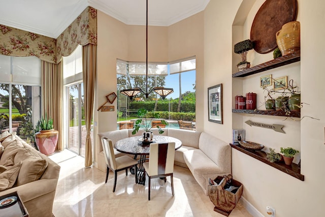 dining room featuring crown molding