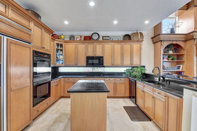 kitchen featuring black appliances, sink, a textured ceiling, a center island, and ornamental molding