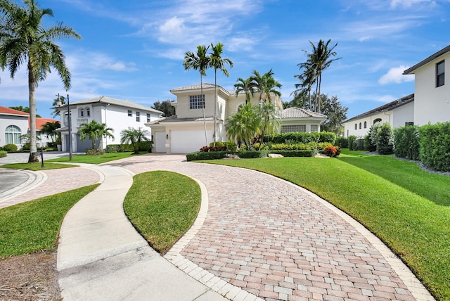 view of front of house featuring a front yard and a garage