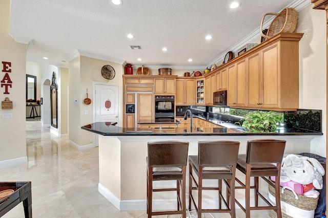 kitchen featuring kitchen peninsula, backsplash, ornamental molding, black appliances, and a textured ceiling