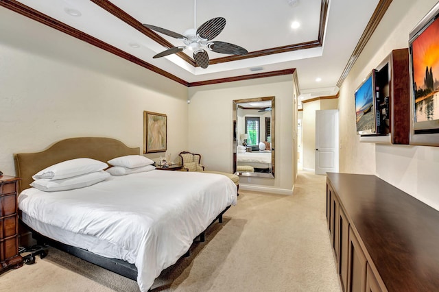 carpeted bedroom featuring ceiling fan, crown molding, and a raised ceiling