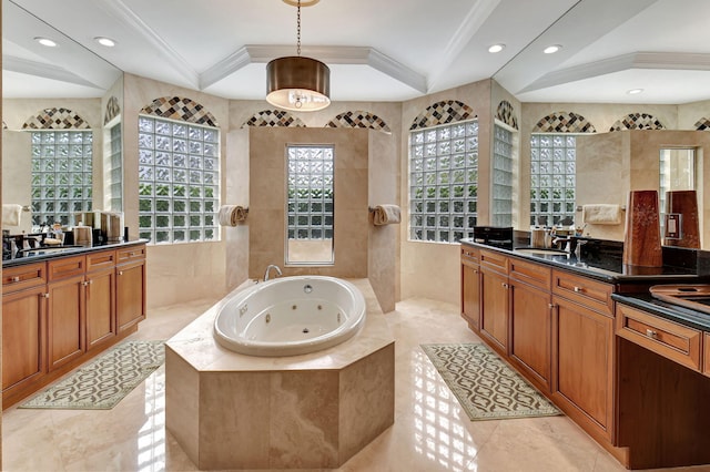 bathroom featuring vanity, tiled bath, ornamental molding, and tile walls