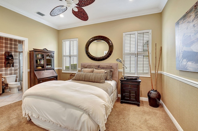 carpeted bedroom with connected bathroom, ceiling fan, and ornamental molding