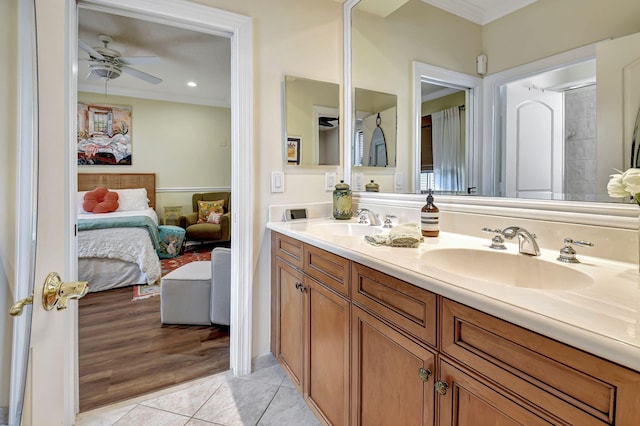 bathroom featuring vanity, ceiling fan, tile patterned floors, and ornamental molding