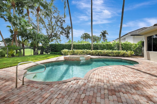 view of pool with a patio area, an in ground hot tub, and a lawn