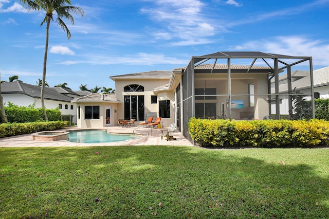 back of house with a patio, a lanai, a lawn, and a swimming pool with hot tub