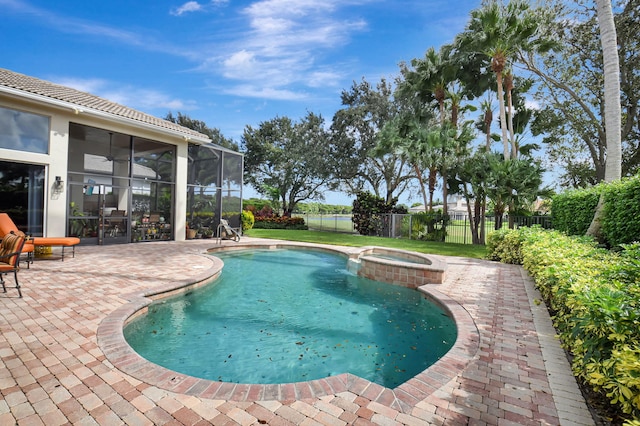 view of pool with an in ground hot tub, a patio, and a lanai