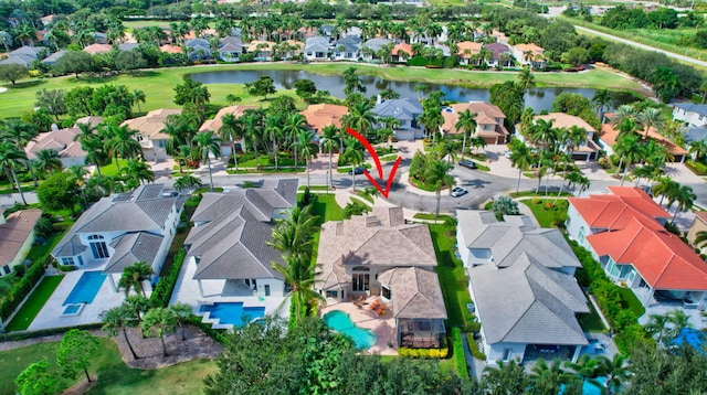 birds eye view of property with a water view