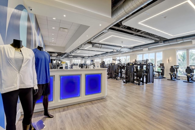 gym featuring light hardwood / wood-style flooring