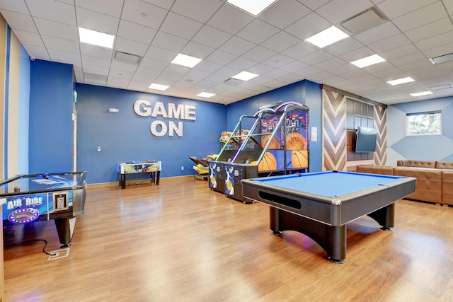 game room featuring a drop ceiling, light hardwood / wood-style flooring, and billiards