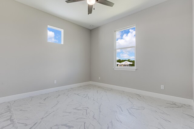 unfurnished room with ceiling fan