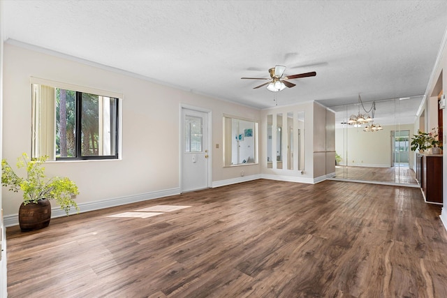 unfurnished living room with ceiling fan with notable chandelier, a textured ceiling, and dark hardwood / wood-style floors