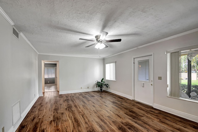 unfurnished room featuring ceiling fan, crown molding, dark hardwood / wood-style floors, and a textured ceiling