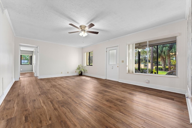 unfurnished living room with dark hardwood / wood-style flooring, ornamental molding, a textured ceiling, and ceiling fan