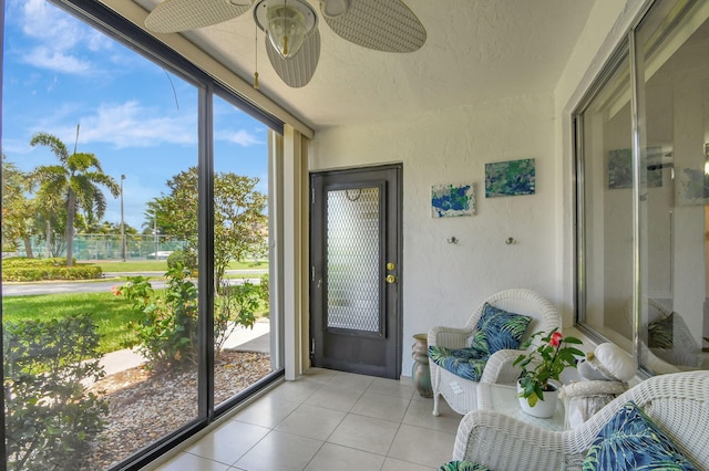 sunroom / solarium with ceiling fan