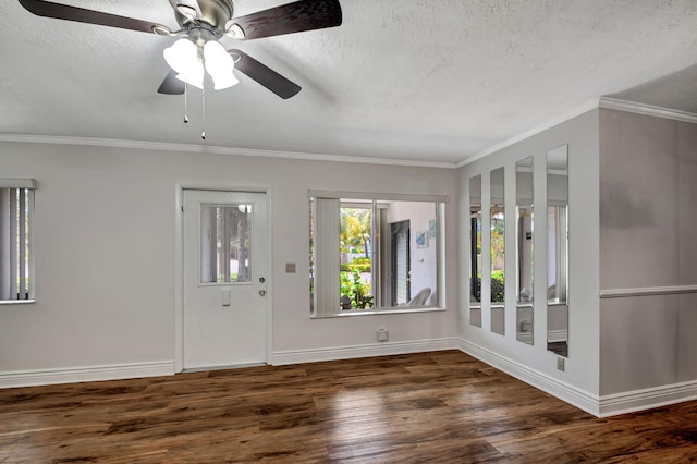 foyer entrance with a textured ceiling, ceiling fan, ornamental molding, and dark hardwood / wood-style floors