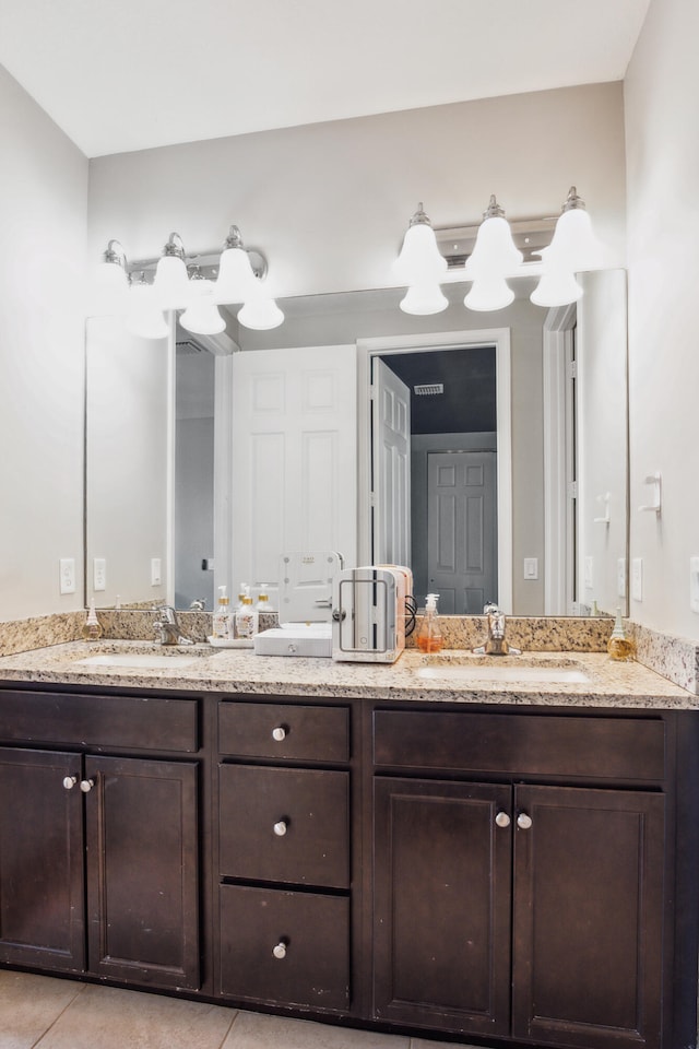 bathroom featuring vanity and tile patterned flooring