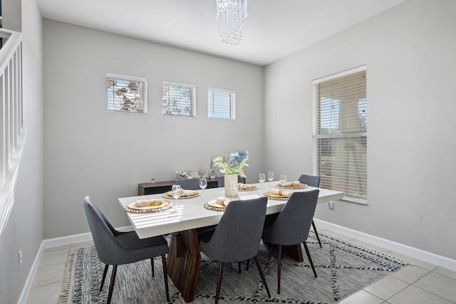 19535 Split Rail Run, Loxahatchee, FL 33470 - dining space featuring light tile patterned flooring, baseboards, and a chandelier