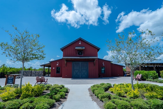 19535 Split Rail Run, Loxahatchee, FL 33470 - view of building exterior with a barn and a detached garage