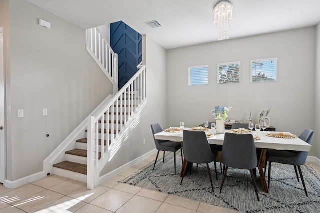 19535 Split Rail Run, Loxahatchee, FL 33470 - tiled dining space featuring stairs, baseboards, and a chandelier