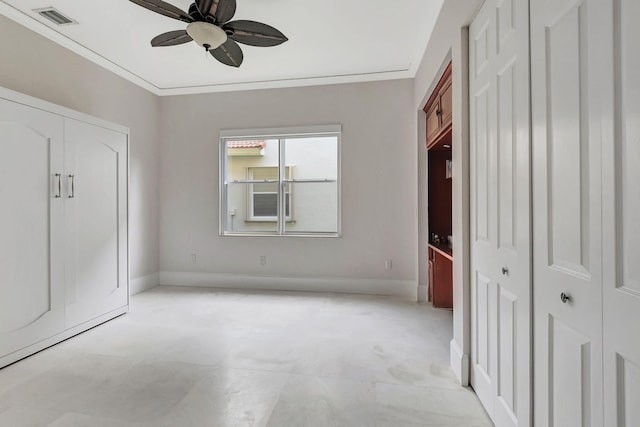 unfurnished bedroom featuring ornamental molding and ceiling fan