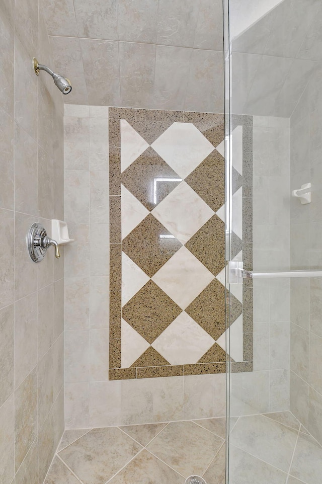 bathroom with a tile shower