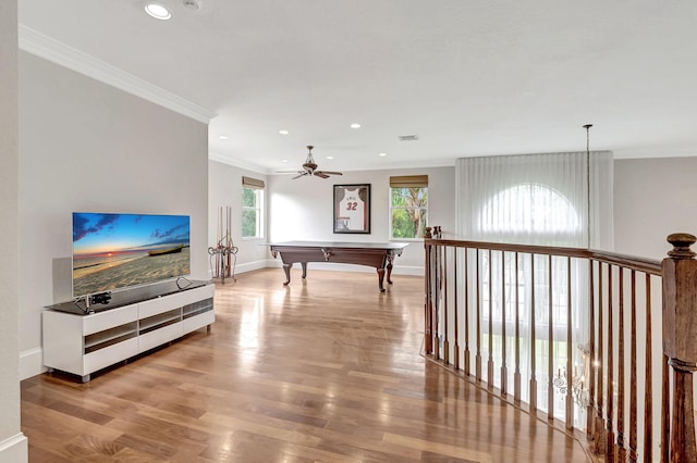 playroom with crown molding, billiards, light wood-type flooring, and a wealth of natural light