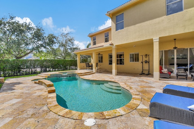 view of swimming pool featuring an in ground hot tub, a patio, and ceiling fan