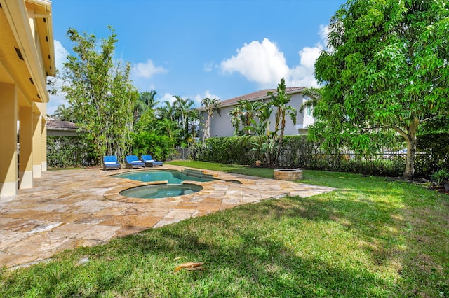 view of pool featuring a patio, an in ground hot tub, and a lawn