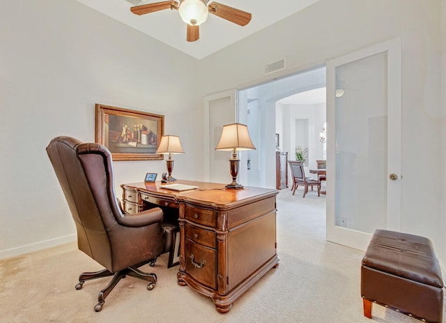 carpeted home office with ceiling fan