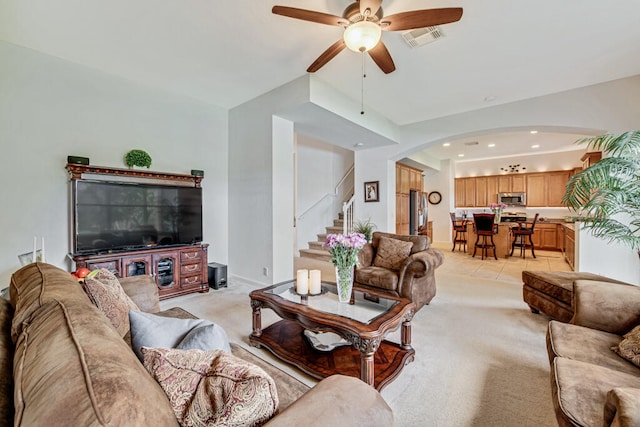 living room with ceiling fan and light carpet