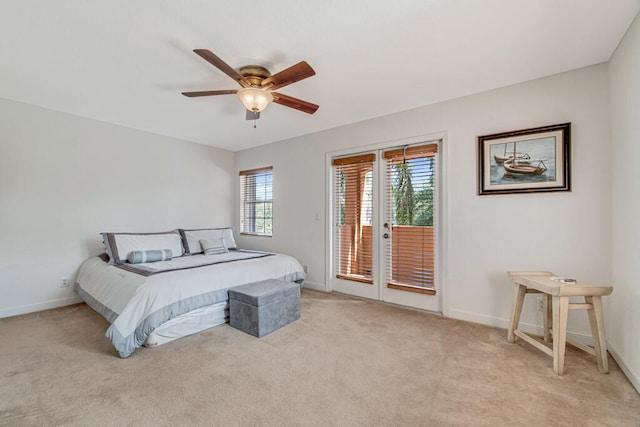 carpeted bedroom featuring access to exterior and ceiling fan