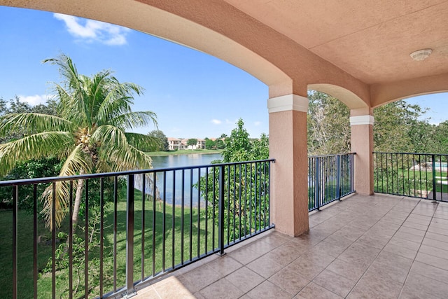 balcony featuring a water view