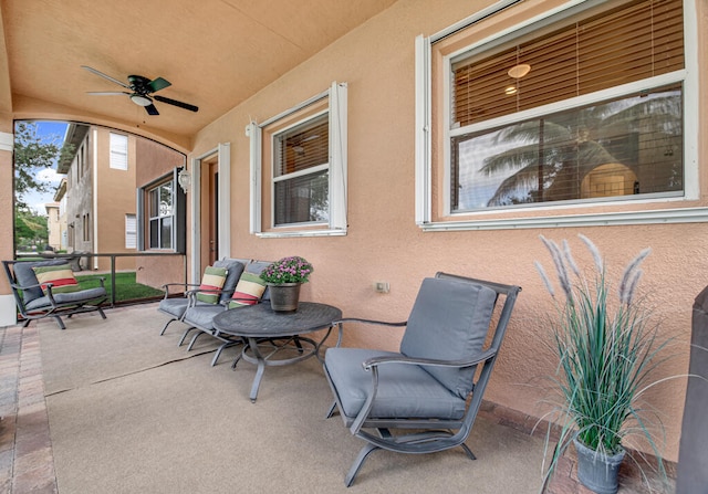 view of patio featuring ceiling fan