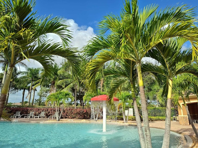 view of swimming pool featuring pool water feature