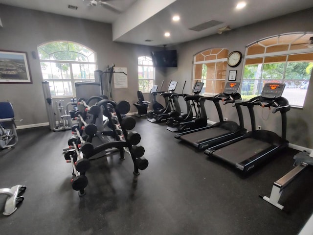 workout area featuring ceiling fan and a healthy amount of sunlight