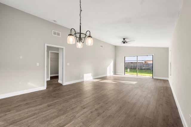 interior space featuring dark wood-type flooring, lofted ceiling, and ceiling fan with notable chandelier