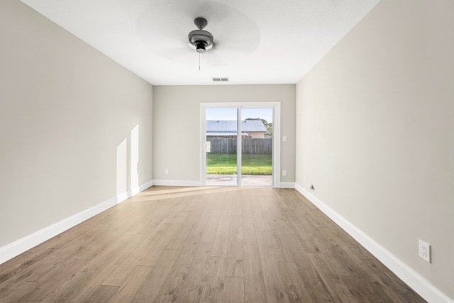 unfurnished room featuring ceiling fan and light hardwood / wood-style floors