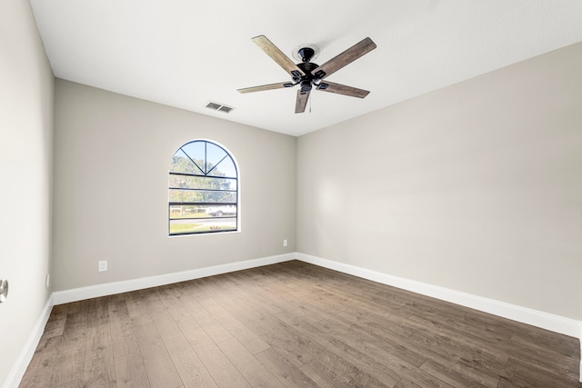 unfurnished room with ceiling fan and hardwood / wood-style floors