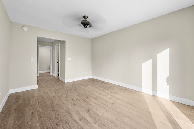 unfurnished room featuring ceiling fan and light hardwood / wood-style flooring