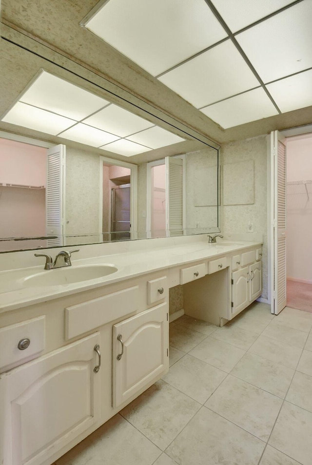 bathroom with tile patterned flooring and vanity